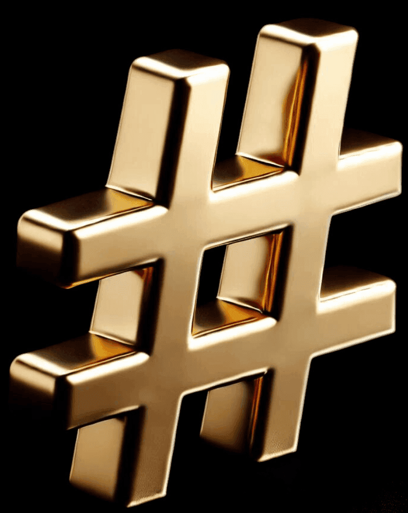 Close-up of a shiny gold hashtag symbol on a black background.